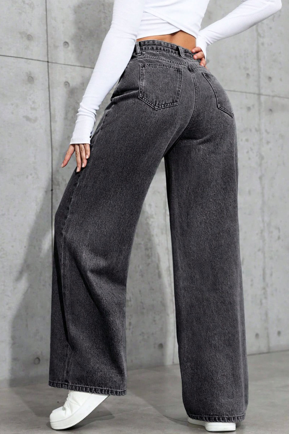 Wide-leg black acid-wash jeans.