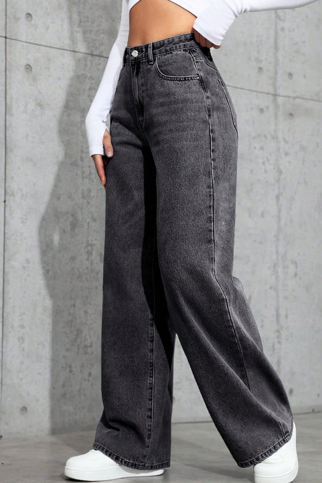 Wide-leg black acid-wash jeans.