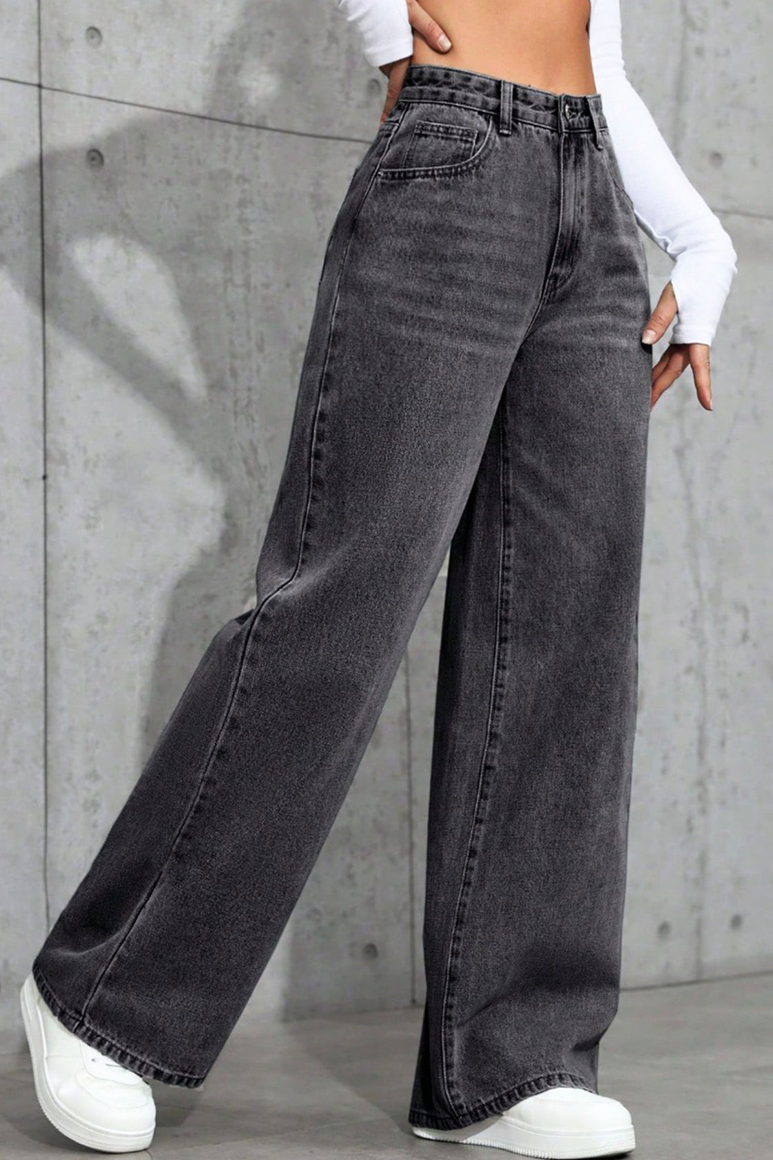 Wide-leg black acid-wash jeans.